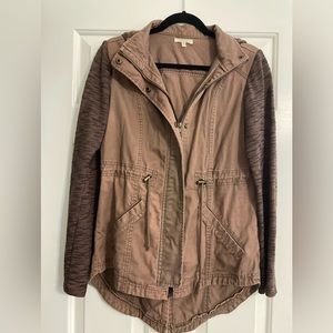 Maurice’s brown jacket with cinched waist.